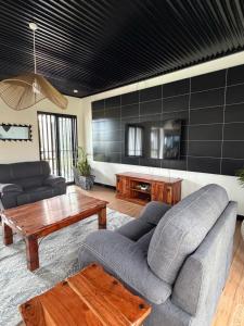 a living room with a couch and a table at Twenty ritz in Migori