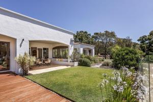a home with a yard with a lawn at Meelup Vista in Dunsborough
