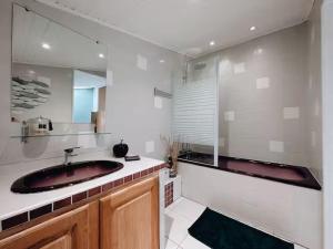 a bathroom with a large red sink and a mirror at Duplex de Charme en Provence, Vue Imprenable in Bargemon +25 photos