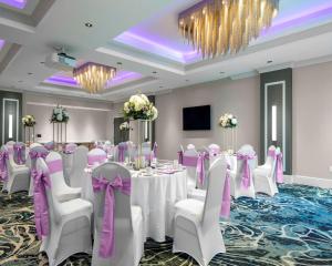 a ballroom with a table and chairs in a room at Hyatt Place Allentown - Lehigh Valley in Allentown