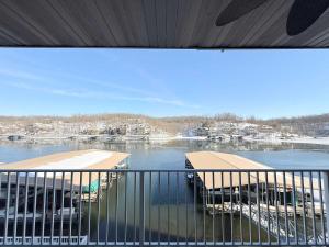 a balcony with a view of a body of water at Lakeside Sunrise Water Views in Camdenton