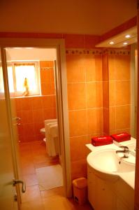 a bathroom with a sink and a toilet and a window at Casa Angelino in Cannobio +44 photos