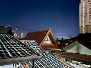 a view of roofs of buildings in a city at Farang house in Pattaya +99 photos