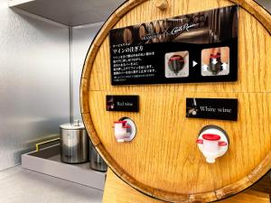 a wooden wall with a sign with white wine at Hotel DIAMOND in Tokyo +71 photos