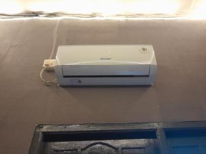 a printer sitting on a wall in a room at Residence 168 in Gununganjar