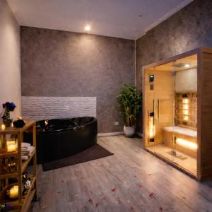 a large bathroom with a tub and a shower at Suite Natura Bed&Beauty Spa in Taranto