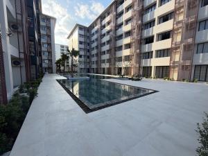 a swimming pool in the middle of a building at Utopia Dream in Rawai Beach