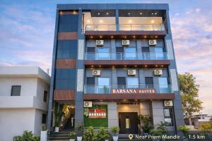 a tall building with akritkritkrit suites sign on it at Barsana Suites in Vrindāvan