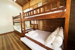 a bunk bed room with two bunk beds in it at Torres Farm Resort powered by Cocotel in Naic +169 photos
