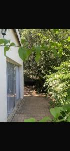a view of a walkway outside of a building at Beach Cresent Cottage in Port Alfred