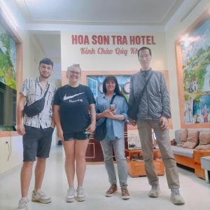 a group of people standing in front of a hotel at Hoa Sơn Tra Hotel in Mù Cang Chải
