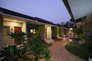 a row of houses with a walkway in front at B Town Resort Near Infopark Kakkanad in Kakkanad