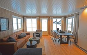 a living room with a couch and a table at Golfvegen 76 in Trysil +8 photos