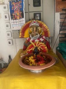 a bowl of food sitting on a table with an umbrella at Stay Castle in Guruvāyūr +7 photos