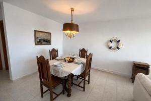 a dining room with a table and chairs at Auba Mar - Alcudia Sea View in Alcudia