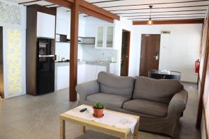 a living room with a couch and a table at Batam View Beach Resort in Nongsa