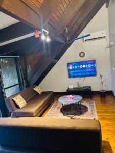 a living room with a couch and a table at Mirz accomodation FJ in Pacific Harbour
