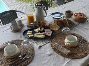 a table with a plate of breakfast food on it at Chez Fab in Ferrières-lès-Ray