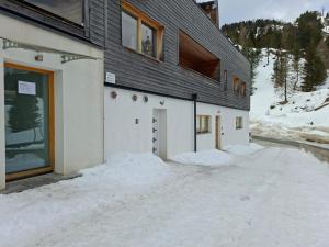 a building with a lot of snow in front of it at FeWo Nocky- Wandern- Berge- Auszeit- Liftnähe in Turracher Hohe +4 photos