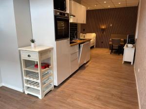 a kitchen with a sink and a counter top at hotel de kaaipoort in Aardenburg