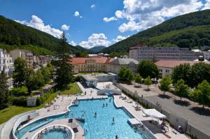 an aerial view of a large swimming pool in a resort at Hotel Slovakia in Martinske Hole