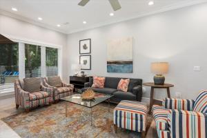 a living room with a couch and chairs at Palm Royale Windsor Townhomes in Key West