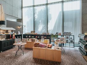 a store with wooden counters and large windows at Kanazawa Kokusai Hotel in Kanazawa