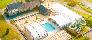 an overhead view of a large building with a pool at domaine de litteau in Litteau