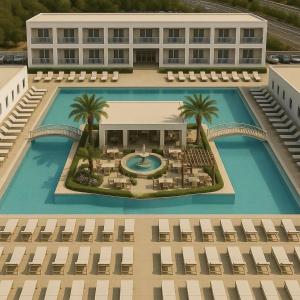 an overhead view of a building with a swimming pool at Evita Dream Hotel in Marmari
