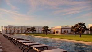 a rendering of a resort with a pool and lounge chairs at Evita Dream Hotel in Marmari