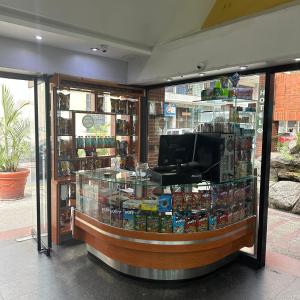 a store with a display case in a store at Hotel Grand Galaxie in Caracas