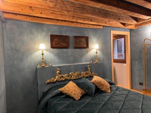 a bedroom with a bed with two lamps on it at NEW OPENING San Marco Secret 4343 in Venice
