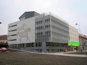 a building with a painting on the side of it at Hotel U koně in Beroun