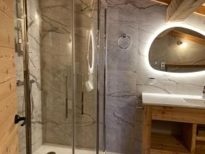a bathroom with a shower and a sink at Vertigo in Puy-Saint-Pierre