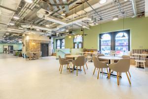 a large room with tables and chairs in a building at Argyl - Broga House Central Cork Accommodation in Cork