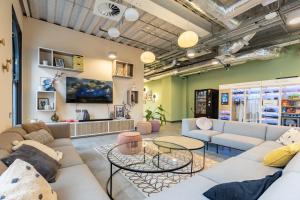 a living room with couches and tables at Argyl - Broga House Central Cork Accommodation in Cork