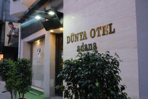 a building with a sign on the side of it at Dünya Otel Adana in Seyhan