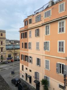 an apartment building in a city with a parking lot at Hotel Center 2 in Rome