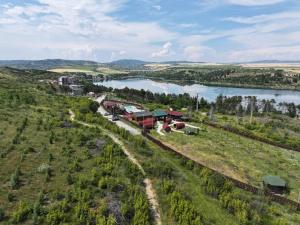 an aerial view of a farm and a river at Eco Camp Lake Mladost in Veles