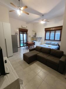 a living room with a couch and a bed at CasettaconVerde in Milan