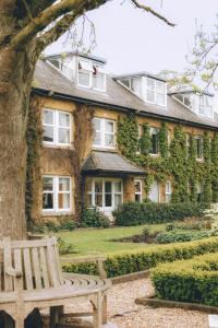 a building with a bench in front of it at The Dunraven, Adare in Adare