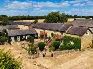 an aerial view of a house with a yard at The Old Stone Barn in Warrington