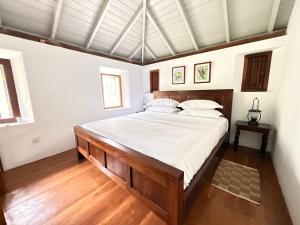 a bedroom with a large bed in a room at Villa Kobeimalhena, Matara in Matara