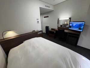 Кровать или кровати в номере Hotel Alpha-One Iwaki