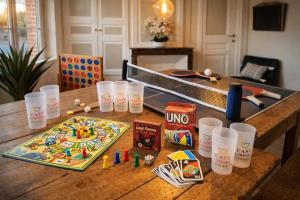 a table with a board game on top of it at Gîte Famille Amis Jeux XXL Paris in Vauchamps