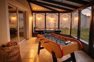 a large game room with a foosball table at Gîte Famille Amis Jeux XXL Paris in Vauchamps