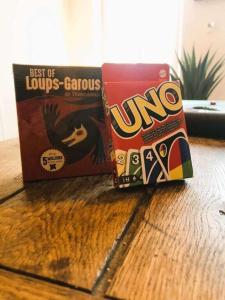 a box of uno chips sitting on a table at Gîte Famille Amis Jeux XXL Paris in Vauchamps +19 photos