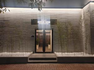 a building with a sign that reads gay guns dawn at 스테이 공담호텔 in Kyū-masan