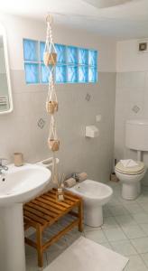 a bathroom with a sink and a tub and a toilet at Ai Canarbin - colline di Lerici in Lerici