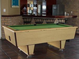 a pool table sitting in a room with at Amies Self-Catering Apartments in Panorama